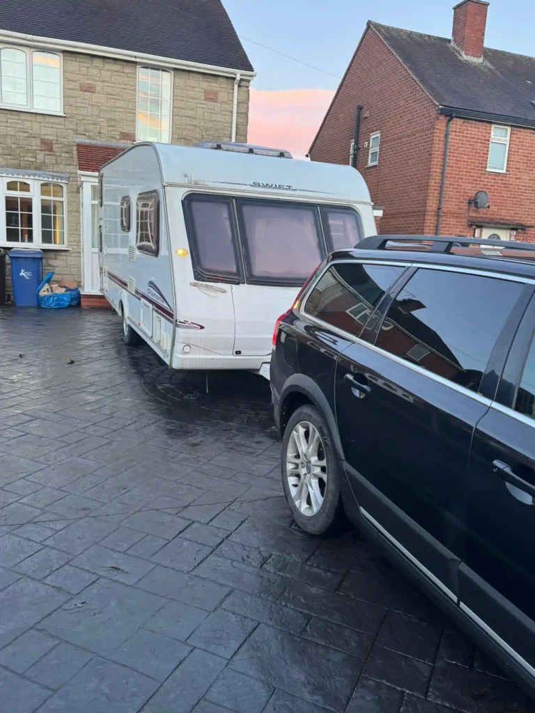 Twin axle touring caravan with red side graphics